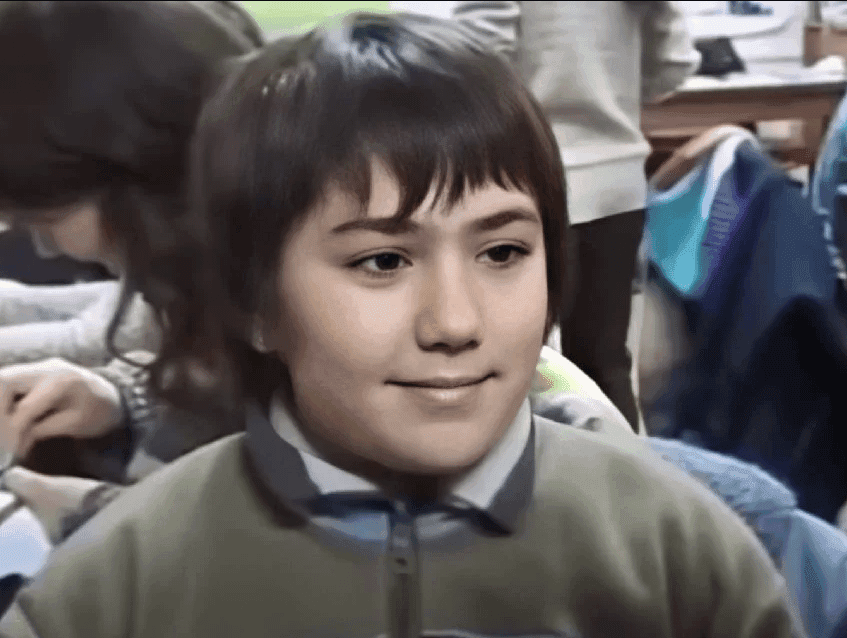 Schoolboy's Subtle Knowing Smirk Reaction
